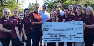 Team Schierl Companies CEOs, co-sponsors, and Associates pose with a check for over $146,000 raised during the 2024 Golf Classic.